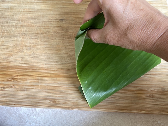 How to prepare banana leaves, When banana leaf doubles-up as baking paper!  bit.ly/corncake_, By SBS Food