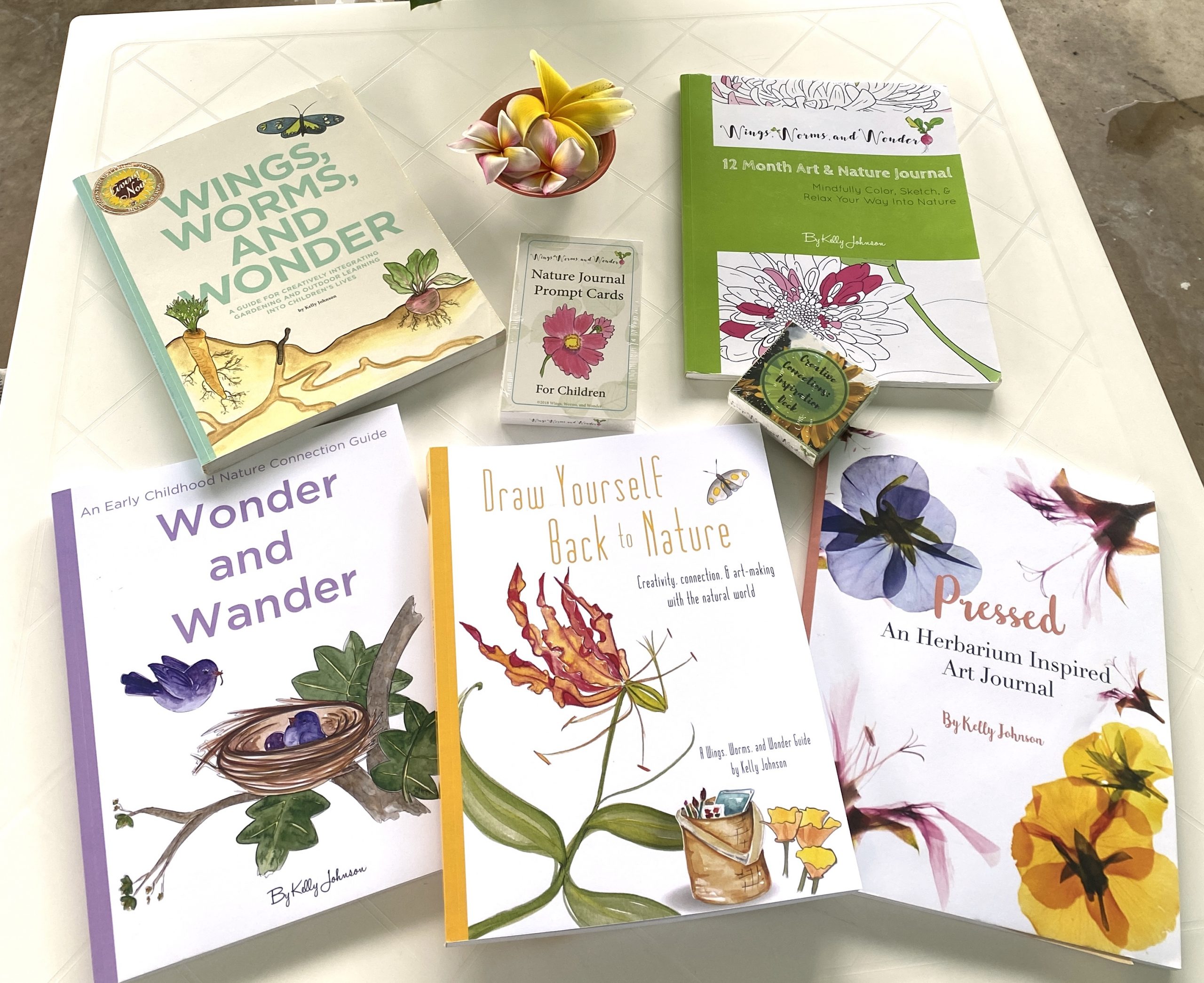 IMG_3993 The family of Wings, Worms, and Wonder creative nature connection guide books!